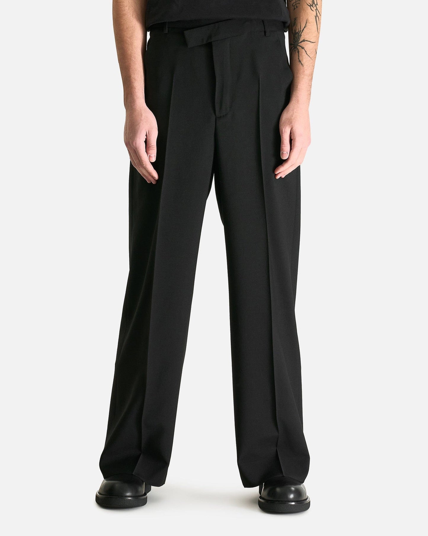 Cyrus Asymmetric Waistband Wide Leg Trousers in Black SVRN Cyrus Asymmetric Waistband Wide Leg Trousers in Black SVRN