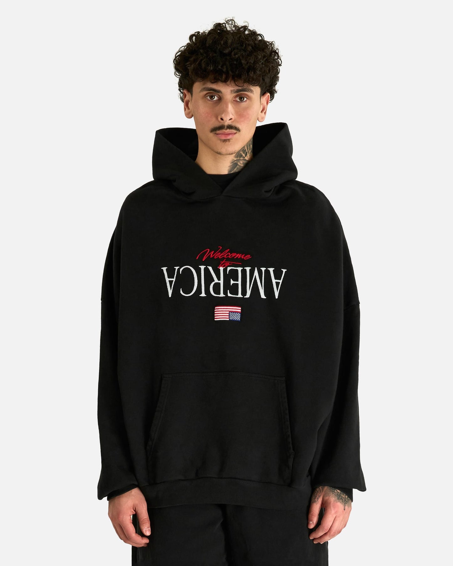 Willy Chavarria Men's Sweatshirts Welcome to America Hooligan Hoodie in Black